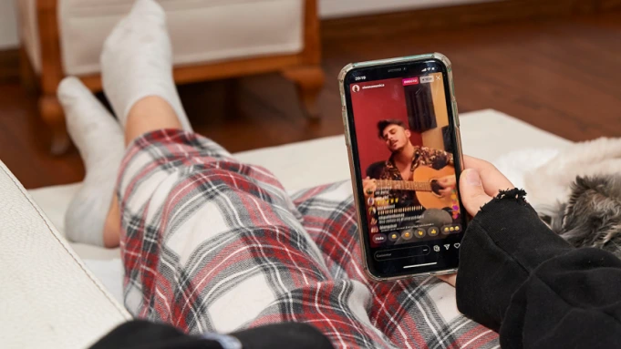 a person watching tiktok on their phone