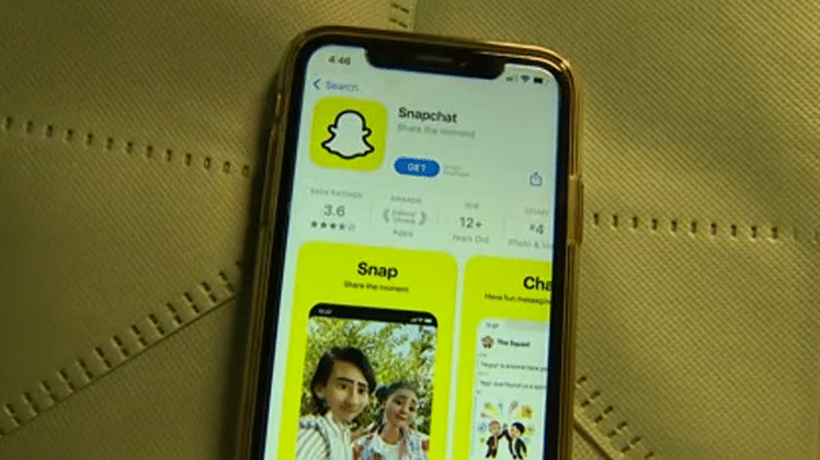 a smart phone with snapchat open on an app store